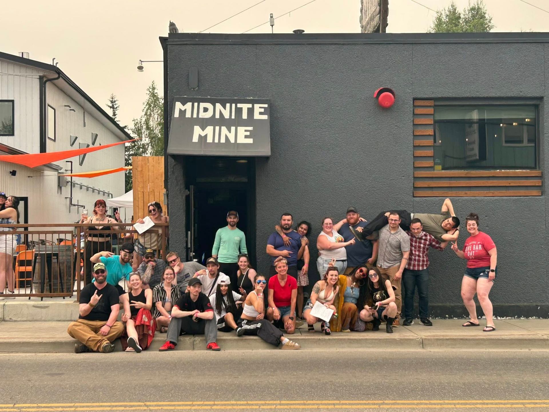 Midnite Mine regulars on Dive Bar Day outside the bar