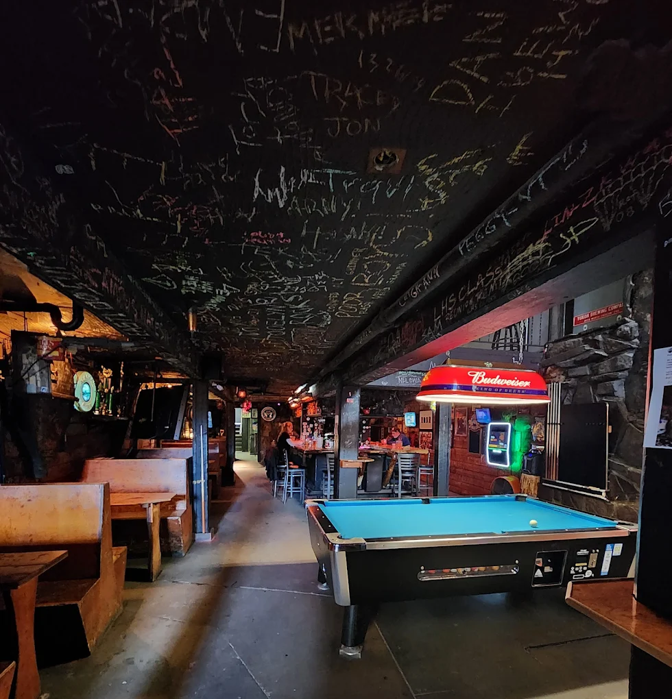 Signed ceiling and pool room at Midnite Mine